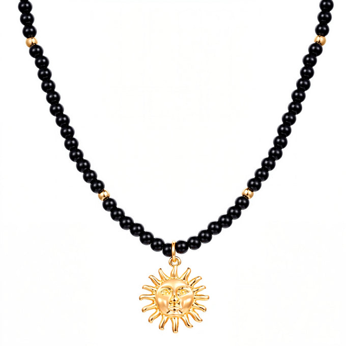 Kette mit Anhänger gelbgold Glas schwarz